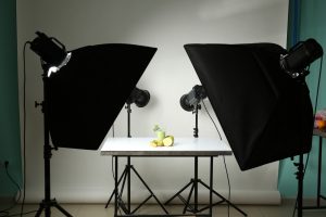 Professional equipment and juice in photo studio. Concept of food photography